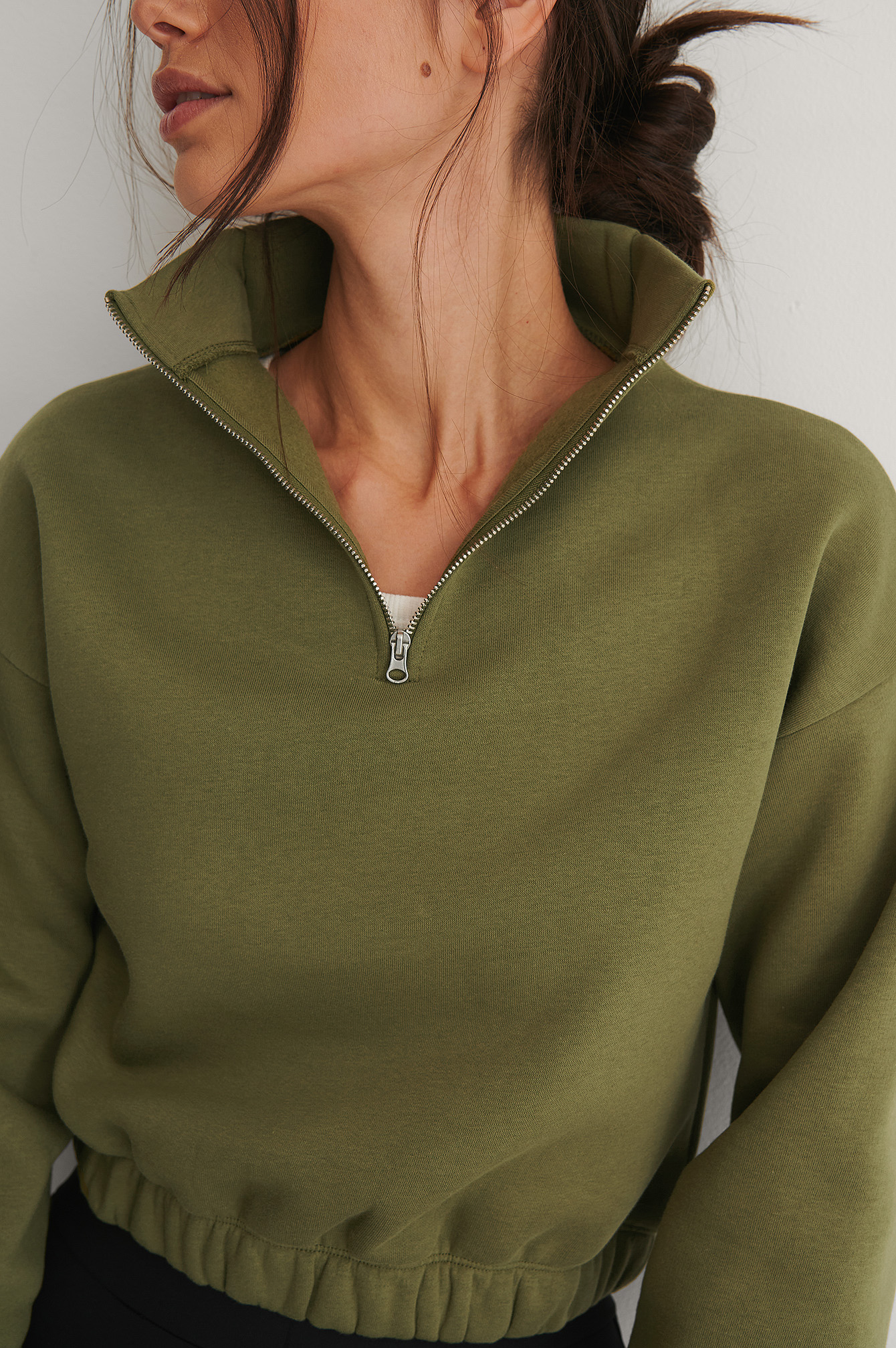 green zip sweater