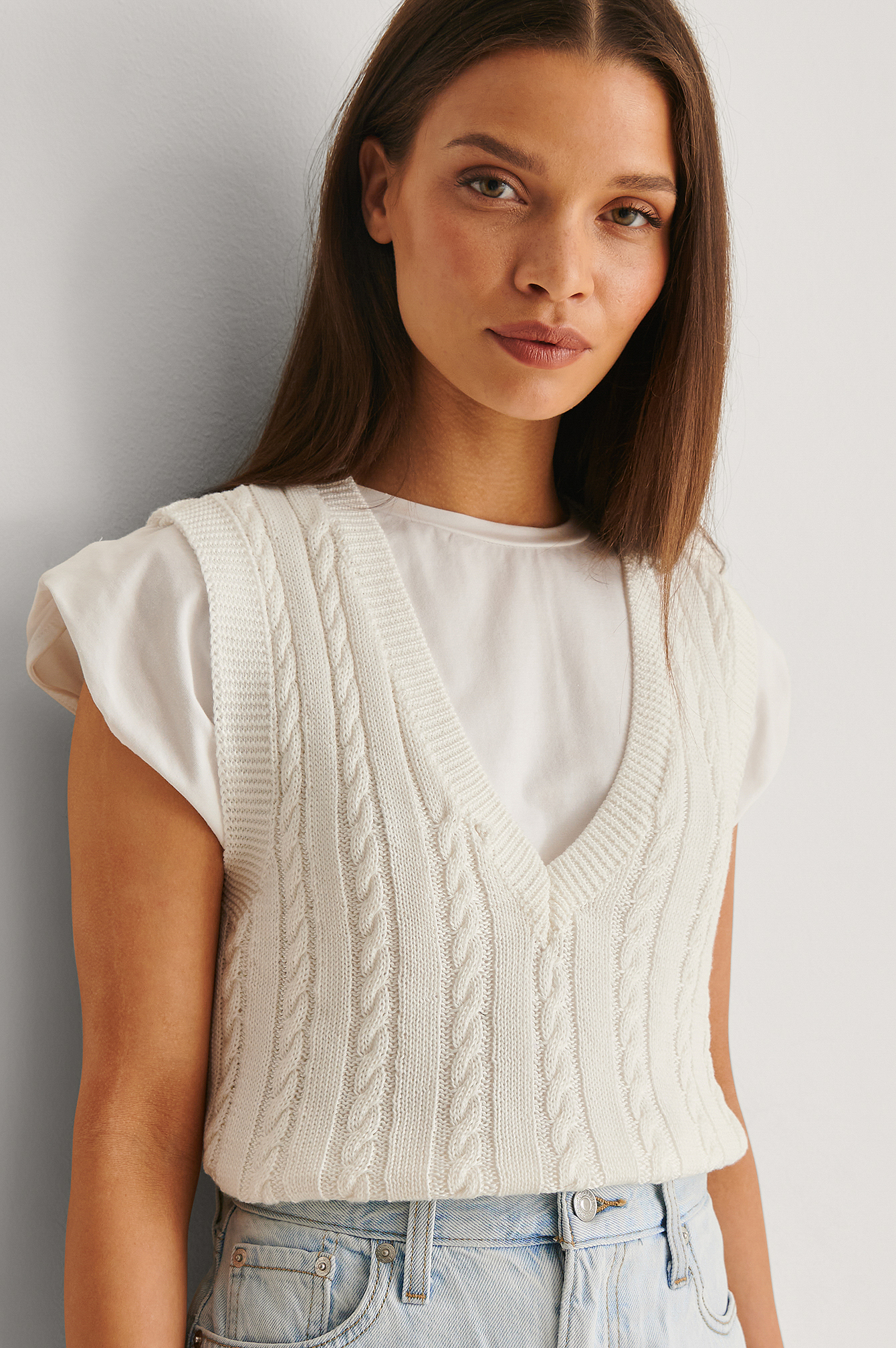 white knitted vest