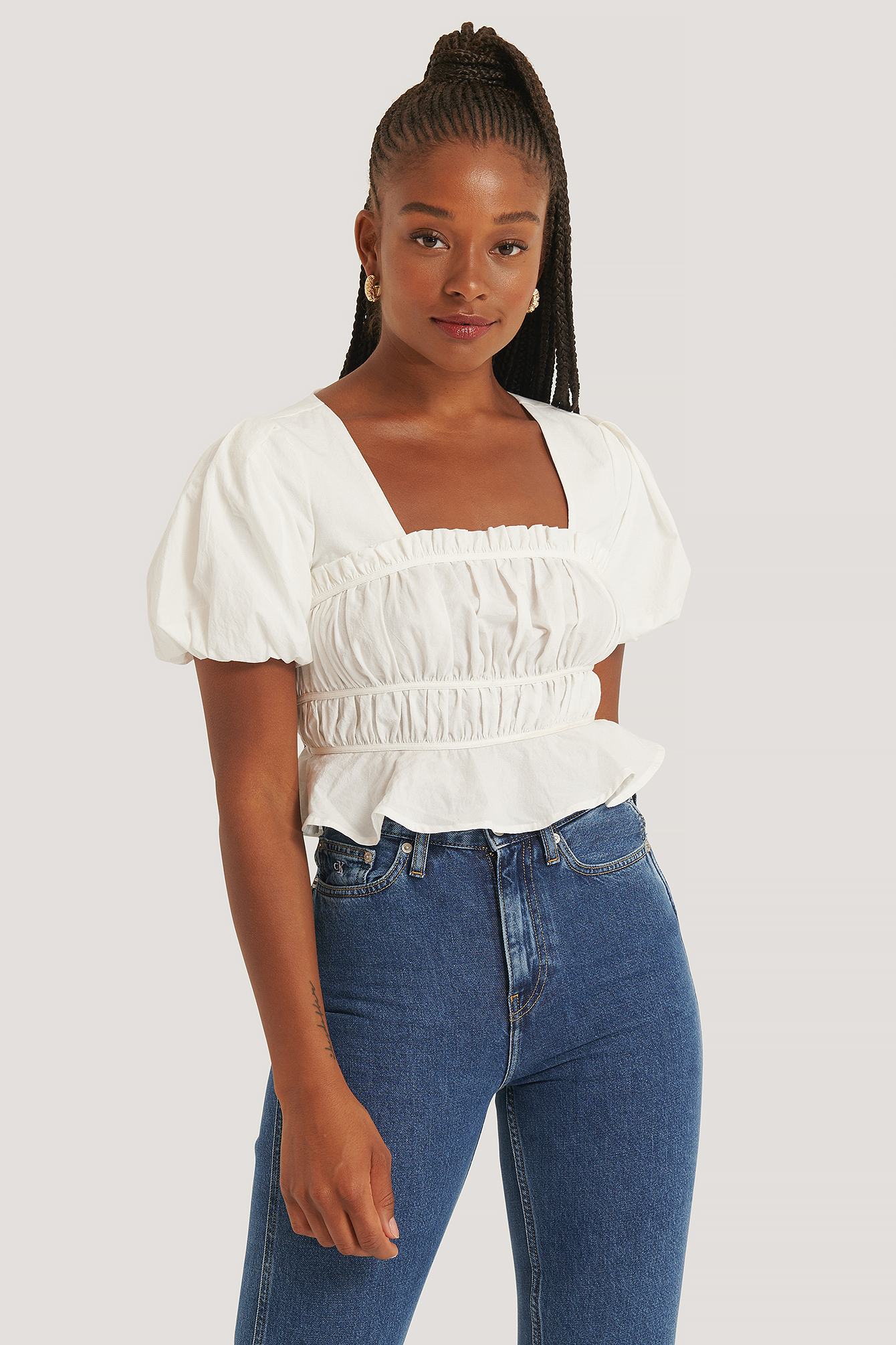 white shoulderless blouse