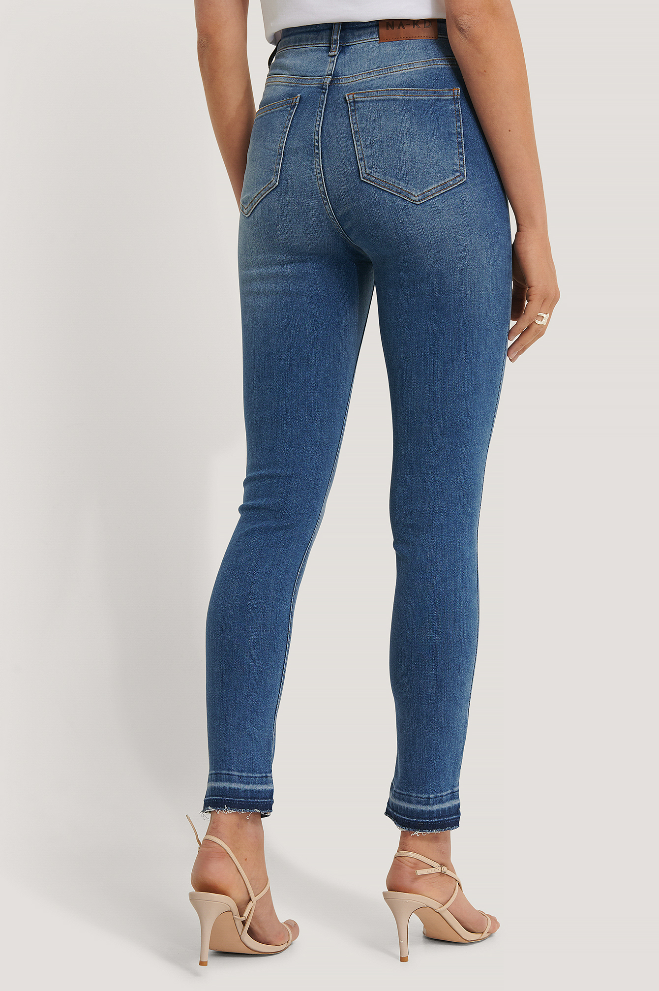 skinny high waist open hem jeans